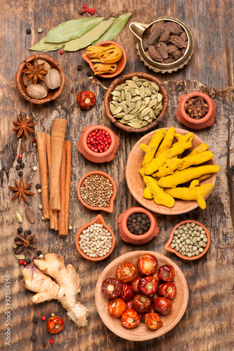 Spices and spicy on a wooden background. Top view