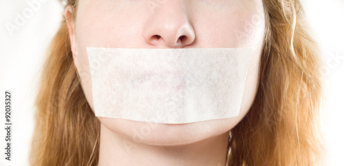 woman with mouth sealed