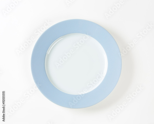 White plate with blue rim