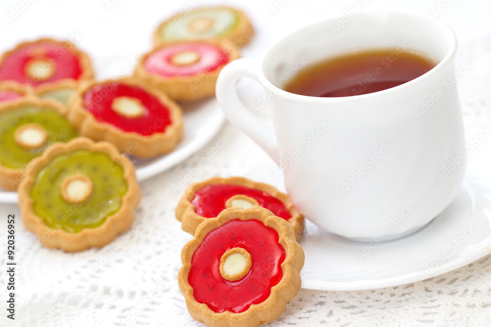 Cup of tea and colorful cookies Cup of tea and colorful cookies
