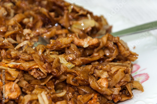 Chinese food noodles with chicken meat and cabbage