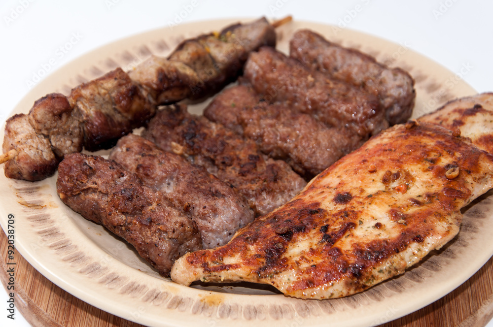 Kebabs and chicken breast on the grill Kebabs and chicken breast on the grill