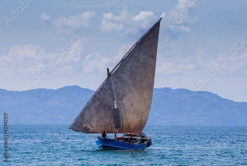 Sailing boat of fishermen in the ocean. Madagascar.