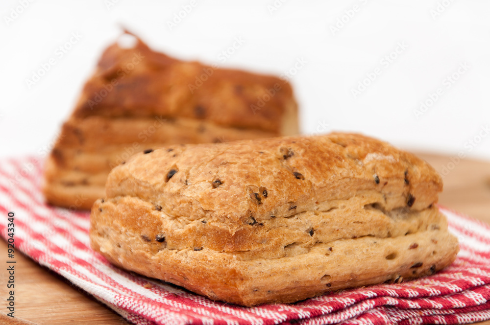 Puff pastry on the kitchen tablecloth and wooden board Puff pastry on the kitchen tablecloth and wooden board