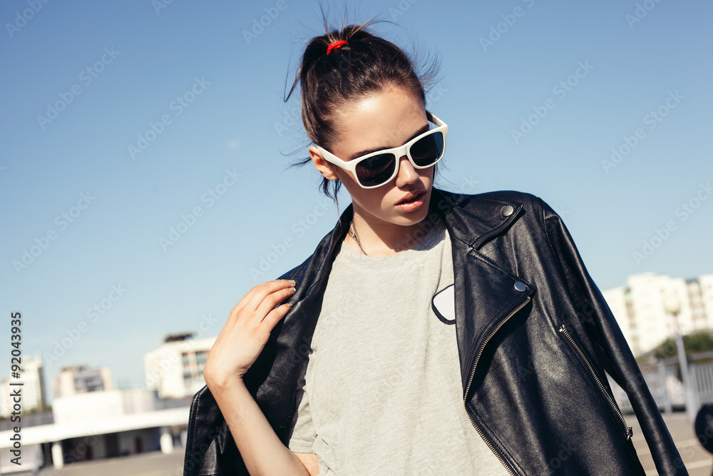 Glamorous young sexy woman in white sunglasses