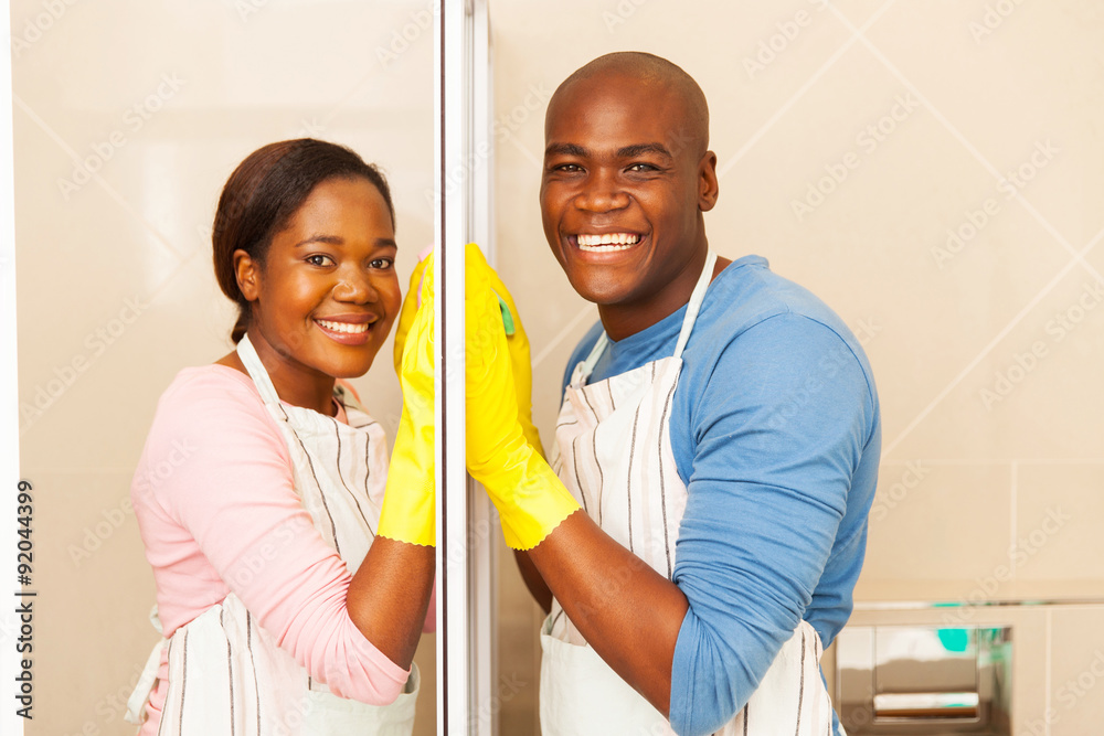 Fototapeta premium afro american couple cleaning bathroom
