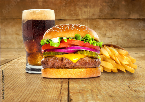 Fries soda burger combo package meal hamburger cheeseburger on table wooden surface delicious perfect deluxe sandwich