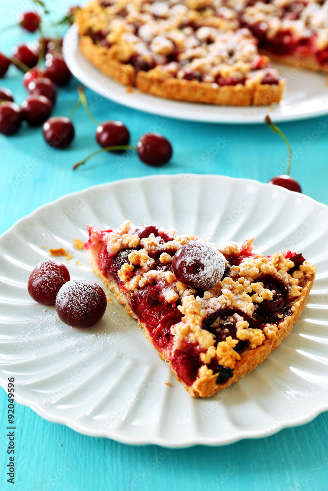 Tasty homemade pie with cherries on table close up Tasty homemade pie with cherries on table close up