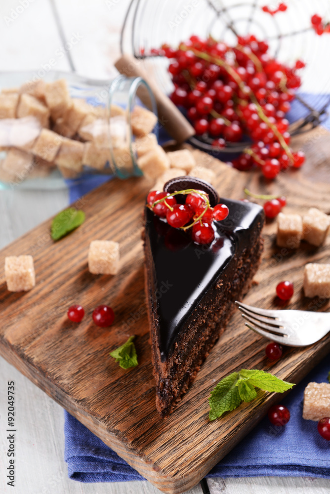 Tasty chocolate cake with berries on table close up Tasty chocolate cake with berries on table close up