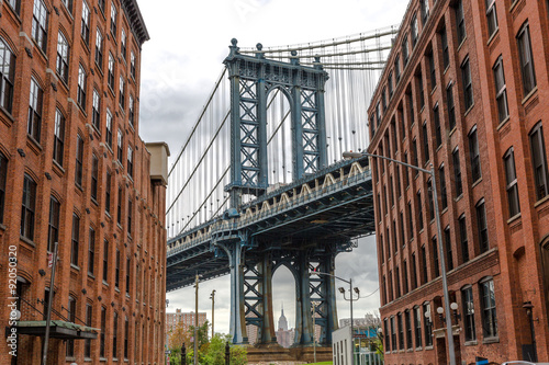 New York City Manhattan Bridge and brick wall building © blvdone
