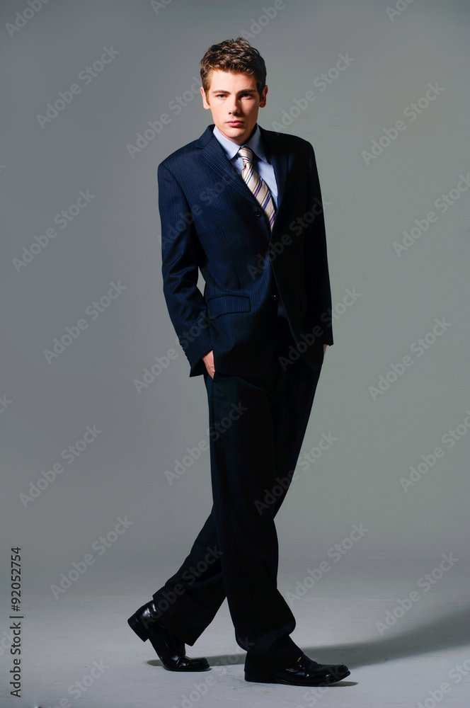 Full body portrait of young happy smiling cheerful business man Full body portrait of young happy smiling cheerful business man