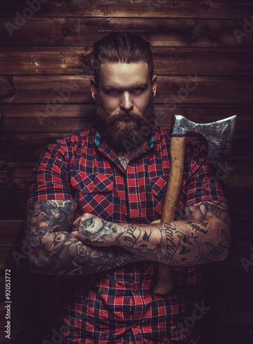 Brutal man with beard and tattooe. photo