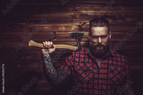 Brutal man with beard and tattooe. photo