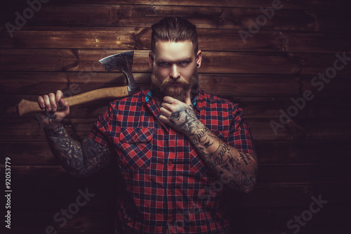 Brutal man with beard and tattooe.