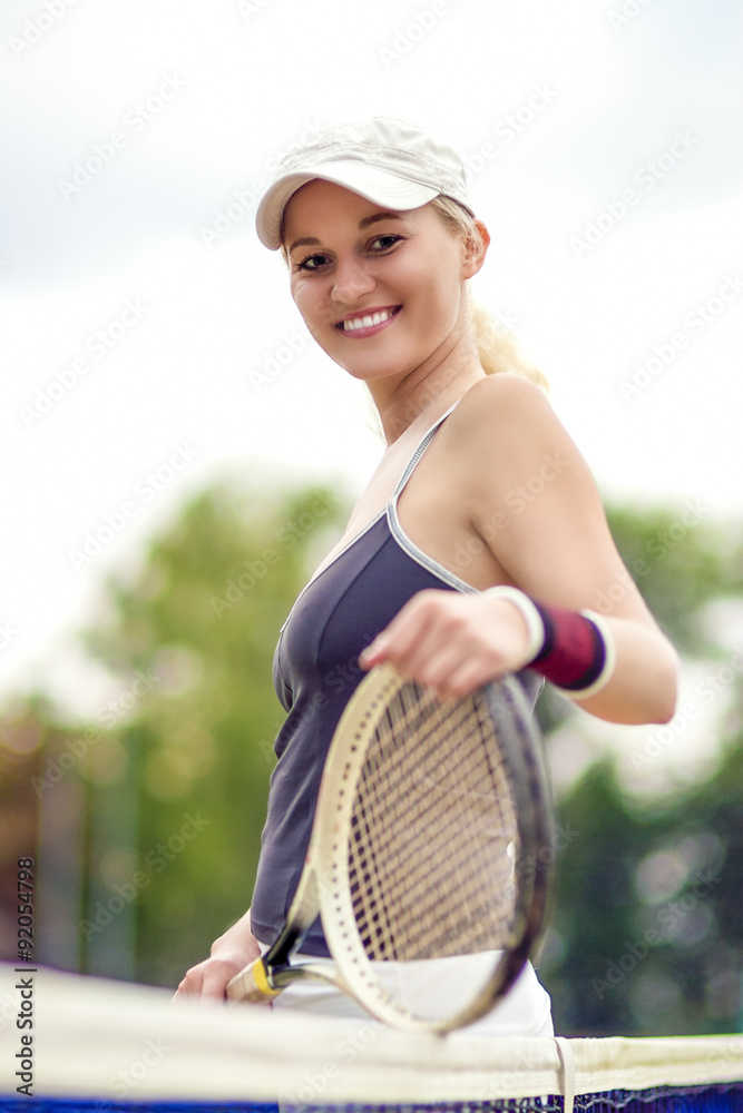Tennis and Health Life Concept: Portrait of Positive Smiling Pro