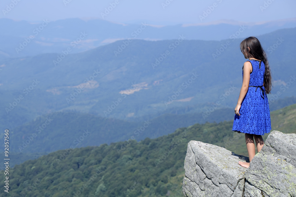 Small girl in mountains