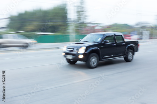 car driving on road with traffic jam in the city, abstract blurred © sutichak