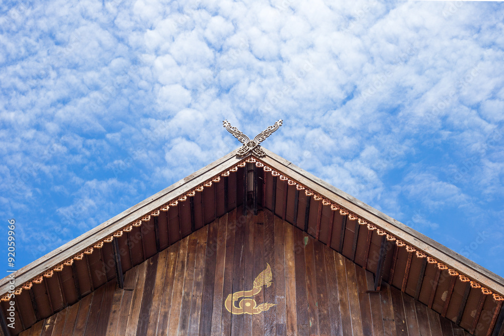 the gable apex of temple on blue sky background the gable apex of temple on blue sky background