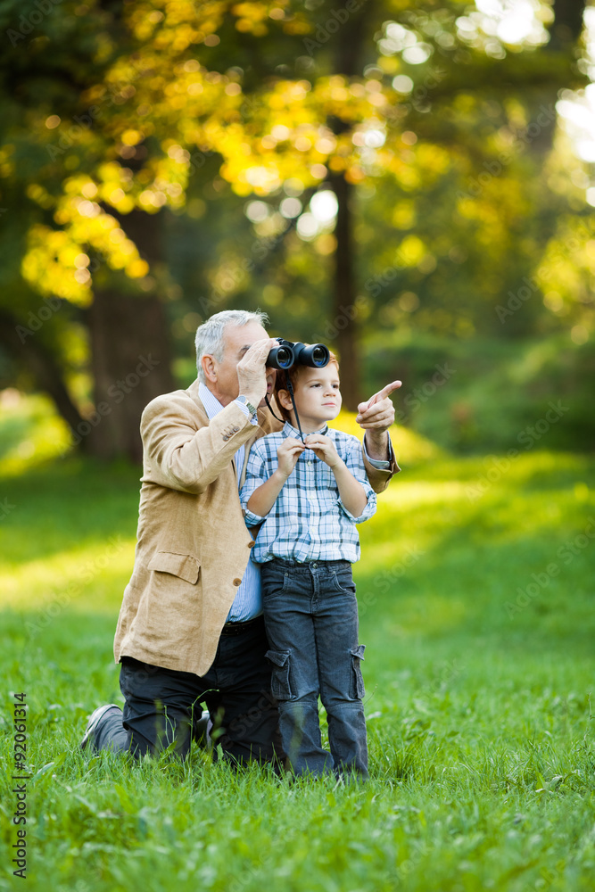 Grandfather and grandson in park Grandfather and grandson in park