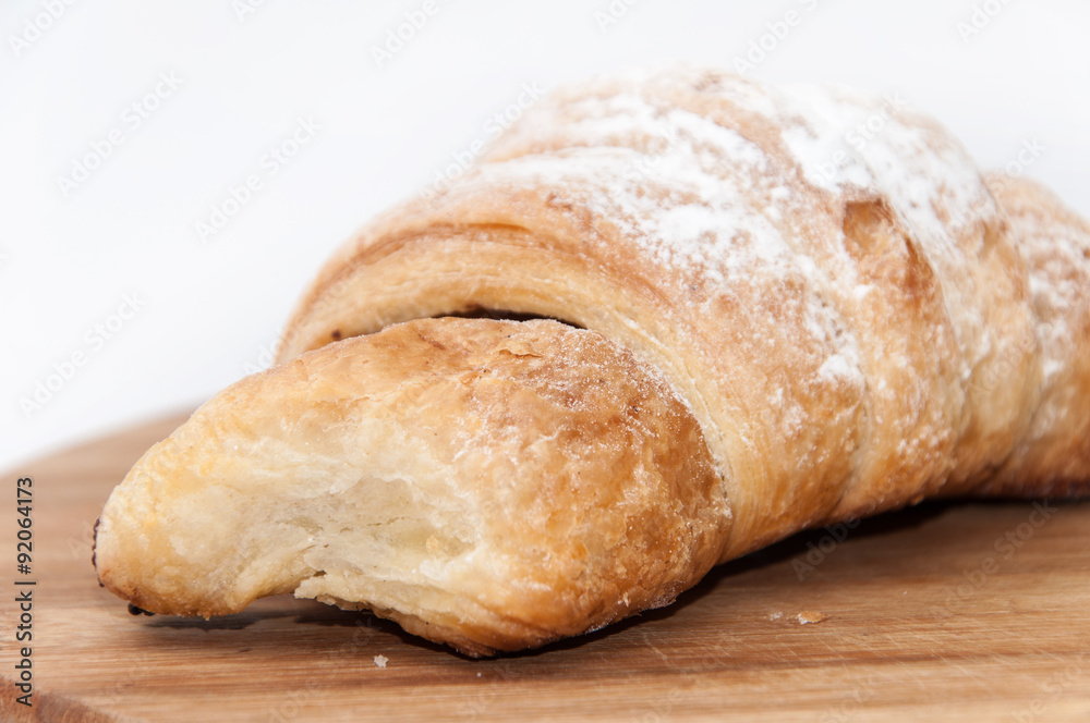 Puff pastry with fruit jam on the wooden board