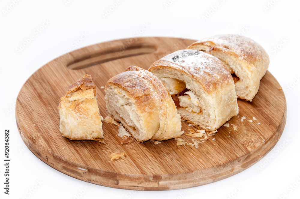 Puff pastry sliced on the wooden board