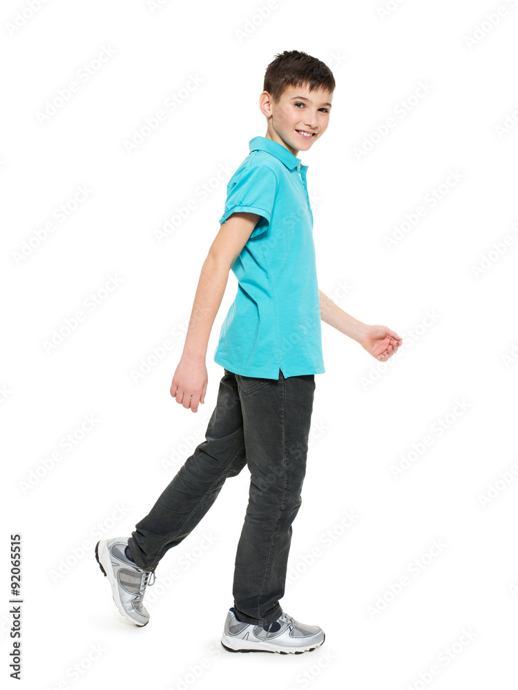 Full portrait of smiling walking teen boy Full portrait of smiling walking teen boy