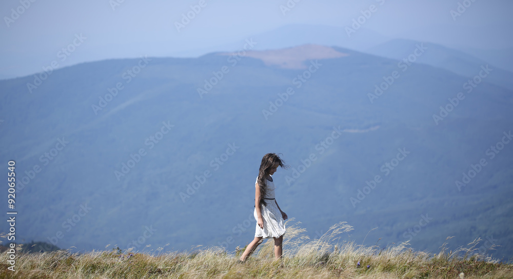 Small girl in mountains