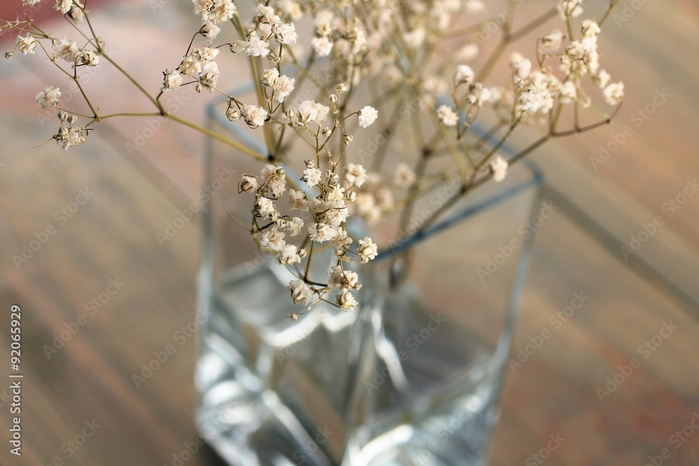 Dried flowers in vase on wooden background Dried flowers in vase on wooden background
