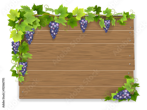 Bunch grapes on wooden sign background