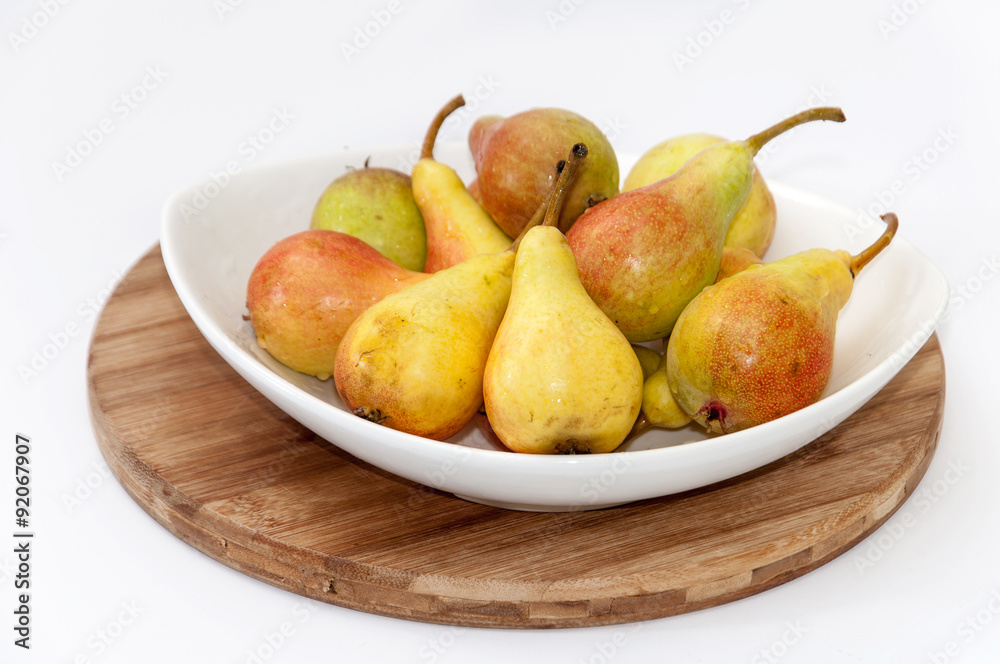 White bowl filled with fresh pears White bowl filled with fresh pears