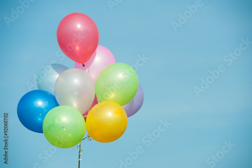 multicolored balloons on blue sky