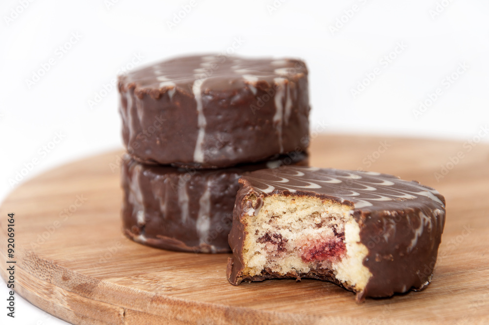 Slice of chocolate muffin on the wooden board Slice of chocolate muffin on the wooden board