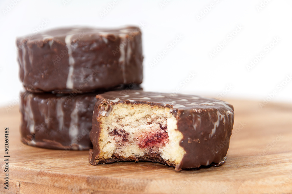 Slice of chocolate muffin on the wooden board Slice of chocolate muffin on the wooden board