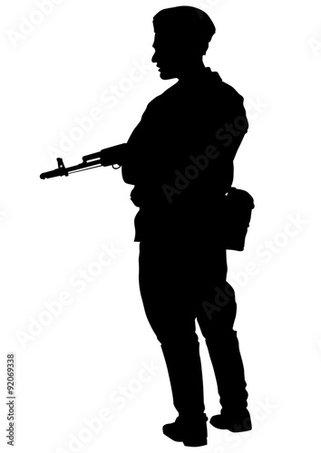 Soldier in uniform with gun on white background