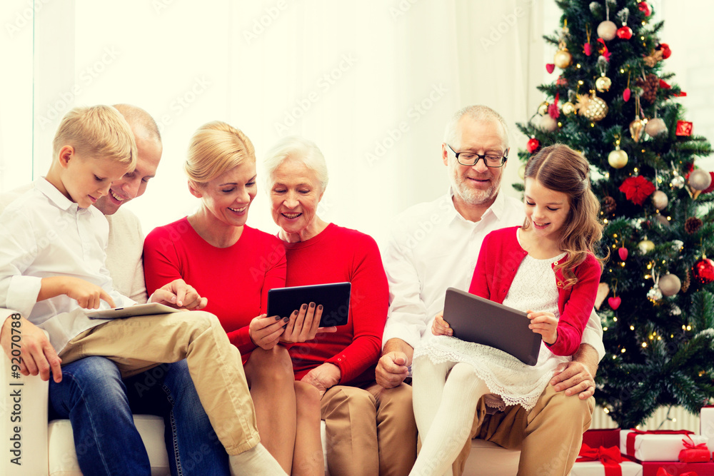smiling family with tablet pc computers at home smiling family with tablet pc computers at home
