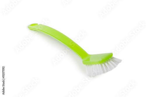 Green dish washing brush on white