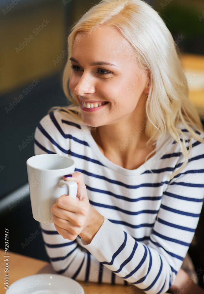 happy young woman drinking tea or coffee happy young woman drinking tea or coffee