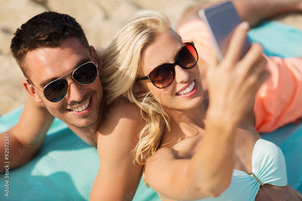 happy couple in swimwear walking on summer beach happy couple in swimwear walking on summer beach