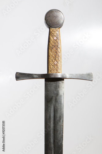 Roses embracing medieval sword