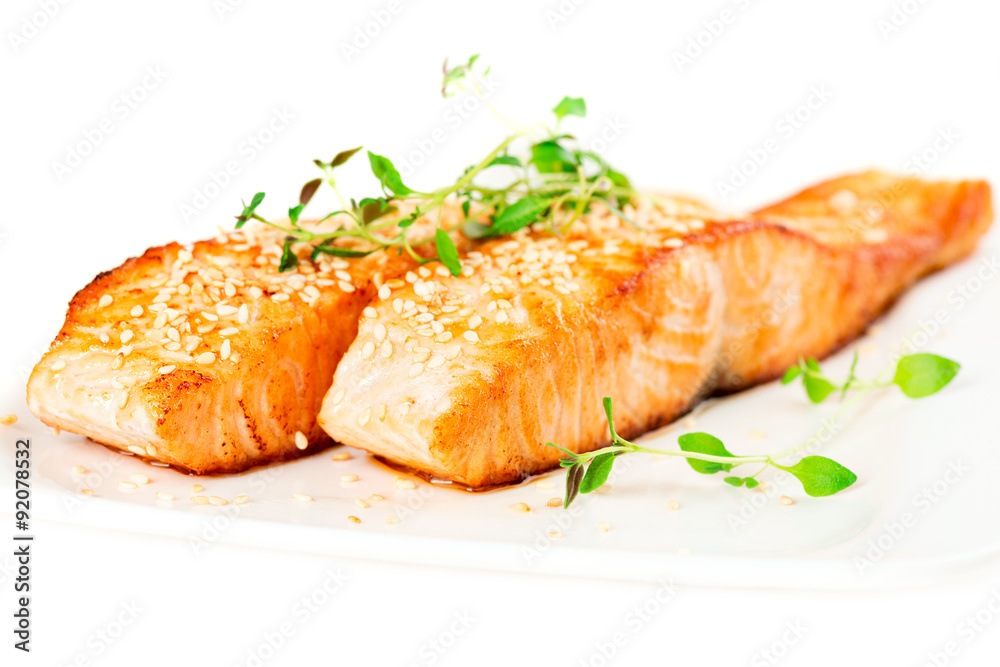 Grilled salmon on white plate Grilled salmon on white plate