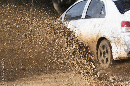 Mud debris splash from a rally car ( Focus at mud debis)
