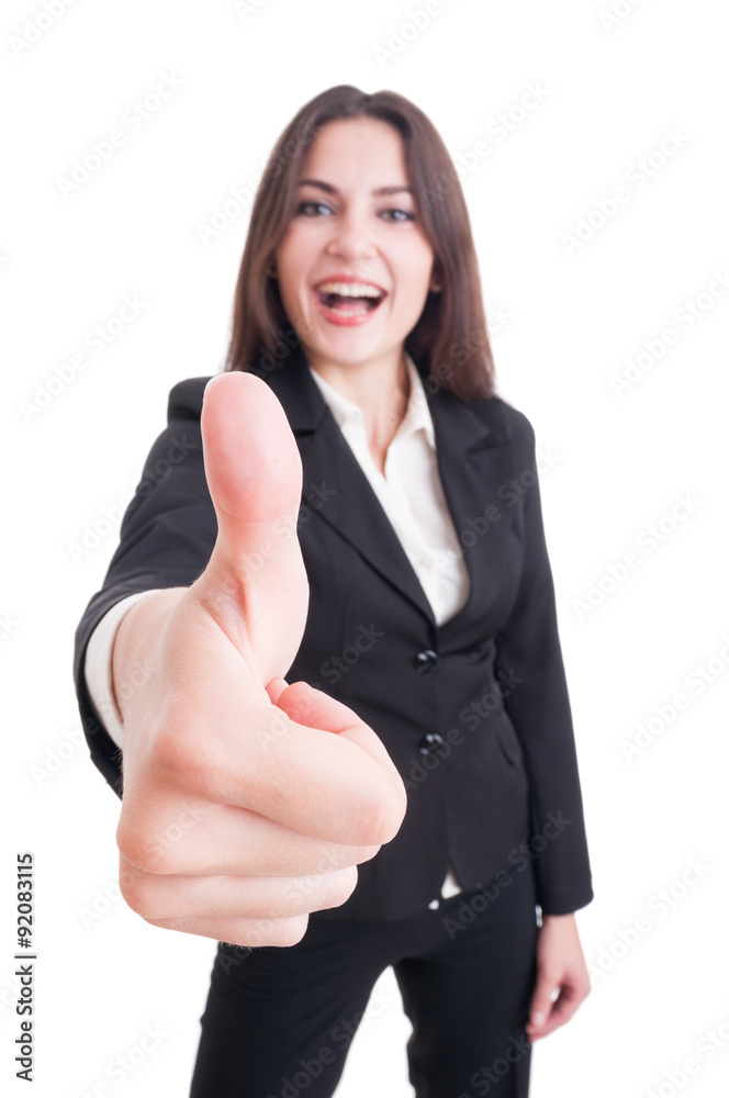 Business woman showing like gesture with selective focus on hand Business woman showing like gesture with selective focus on hand