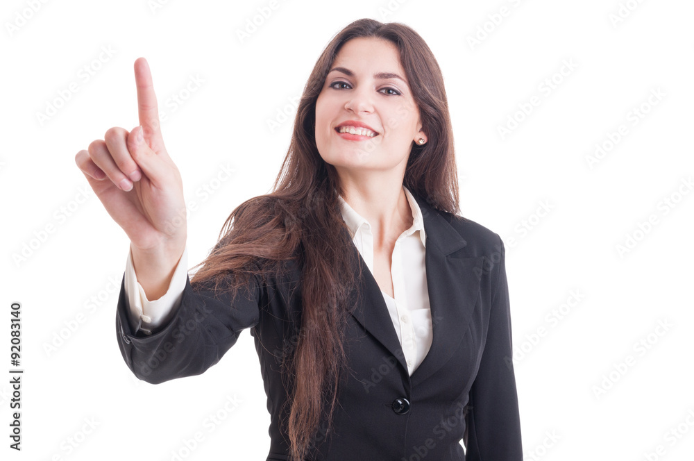 Beautiful business woman touching transparent screen with index Beautiful business woman touching transparent screen with index