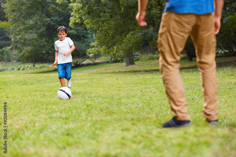 Family playing football. Father and son having fun. Family playing football. Father and son having fun.