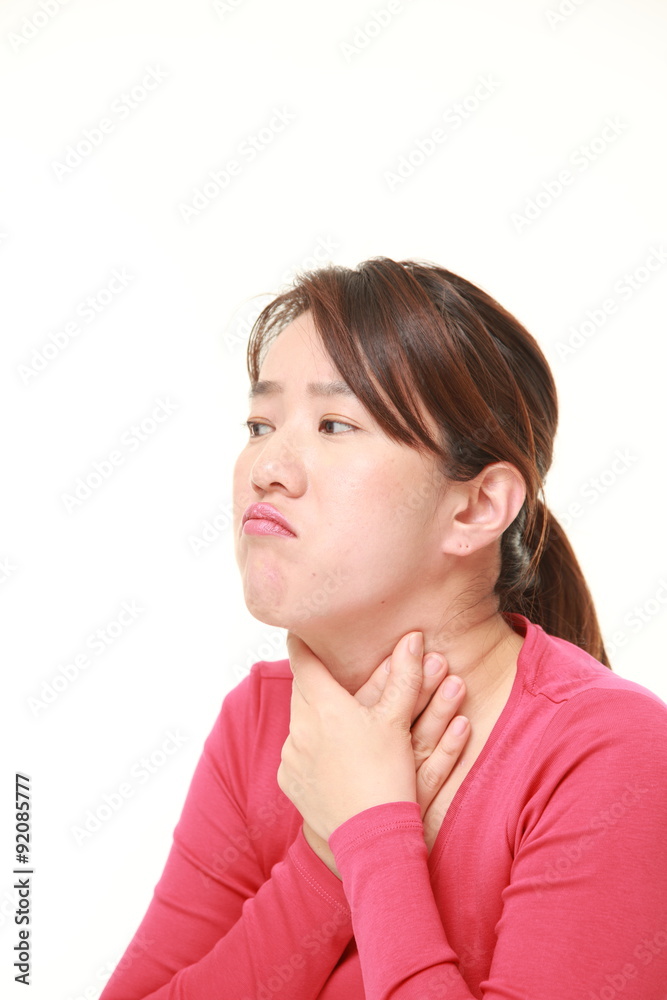 Japanese woman having throat pain Japanese woman having throat pain