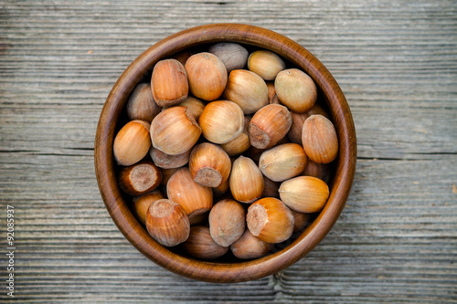 nuts in a bowl - rustic wooden table