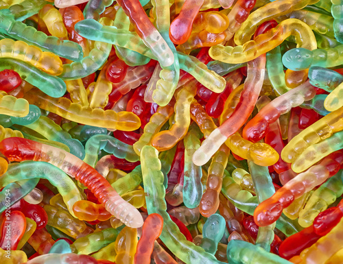 colorful worm shaped candies  sweet background