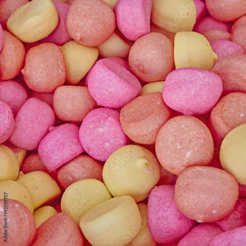 pale pink and yellow candies  sweet background