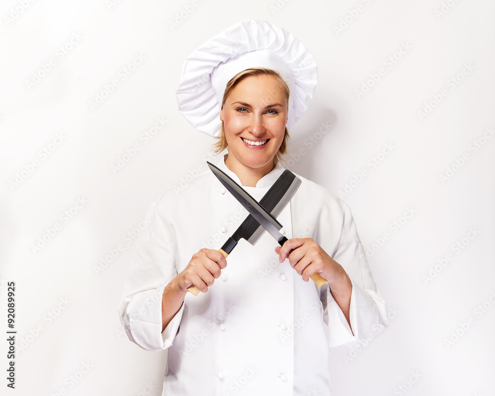 Chef woman on white background with knifes crosed, siling. Chef woman on white background with knifes crosed, siling.
