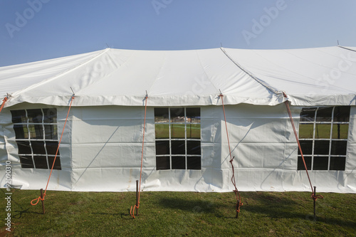 Tent white large mobile entertainment celebration facility structure on field © ChrisVanLennepPhoto